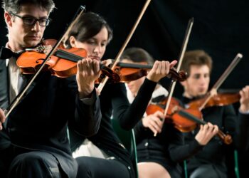 Musicians performing at music celebrations concert in European venue honoring St Cecilias Day traditions