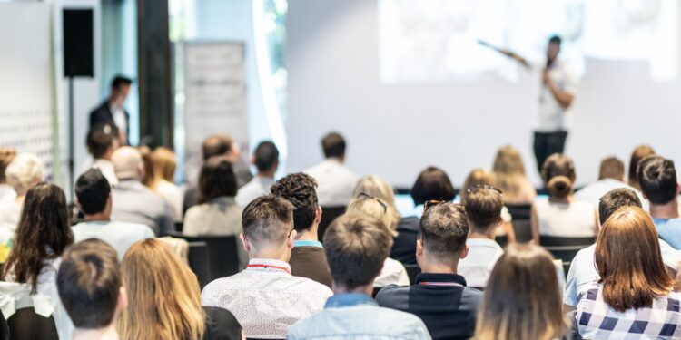 Professional networking events in modern European conference center with business attendees