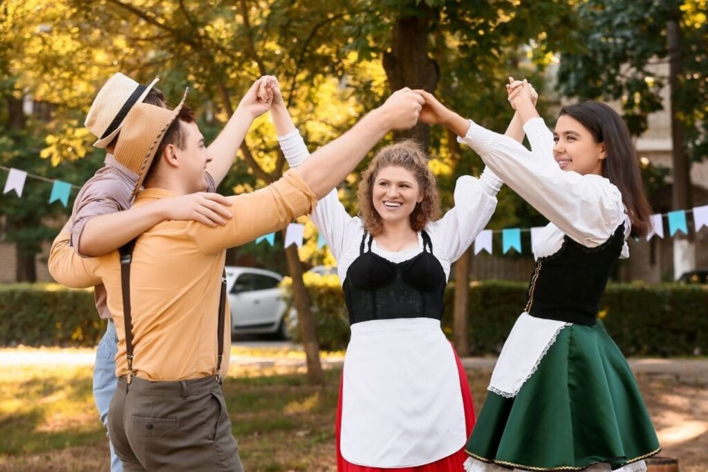 Young European dancers perform traditional folk dance in cultural costumes at heritage festival, blending authentic European traditions with contemporary energy, showcasing how Gen Z reimagines culture across Europe.