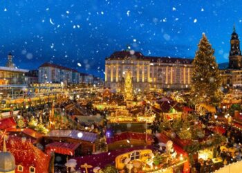 Traditional German Christmas markets with festive wooden chalets and twinkling lights beneath Cologne Cathedral, showcasing authentic European holiday traditions with mulled wine and handcrafted gifts