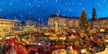 Traditional German Christmas markets with festive wooden chalets and twinkling lights beneath Cologne Cathedral, showcasing authentic European holiday traditions with mulled wine and handcrafted gifts