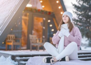 European woman practicing mindfulness meditation for holiday stress relief in peaceful indoor setting, demonstrating effective wellness strategies managing December celebration pressures and anxiety reduction