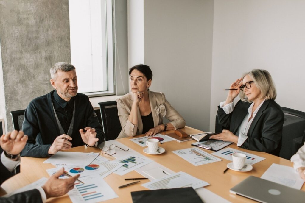 Healthcare investment Europe with professionals discussing private hospital sector opportunities