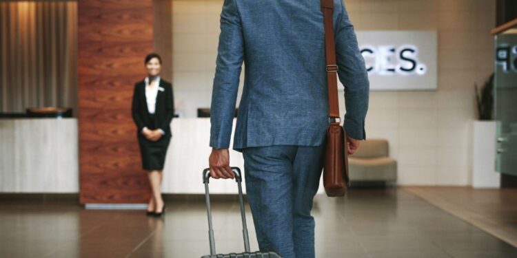 European business travel with professional travelers at airport representing corporate hotel trends
