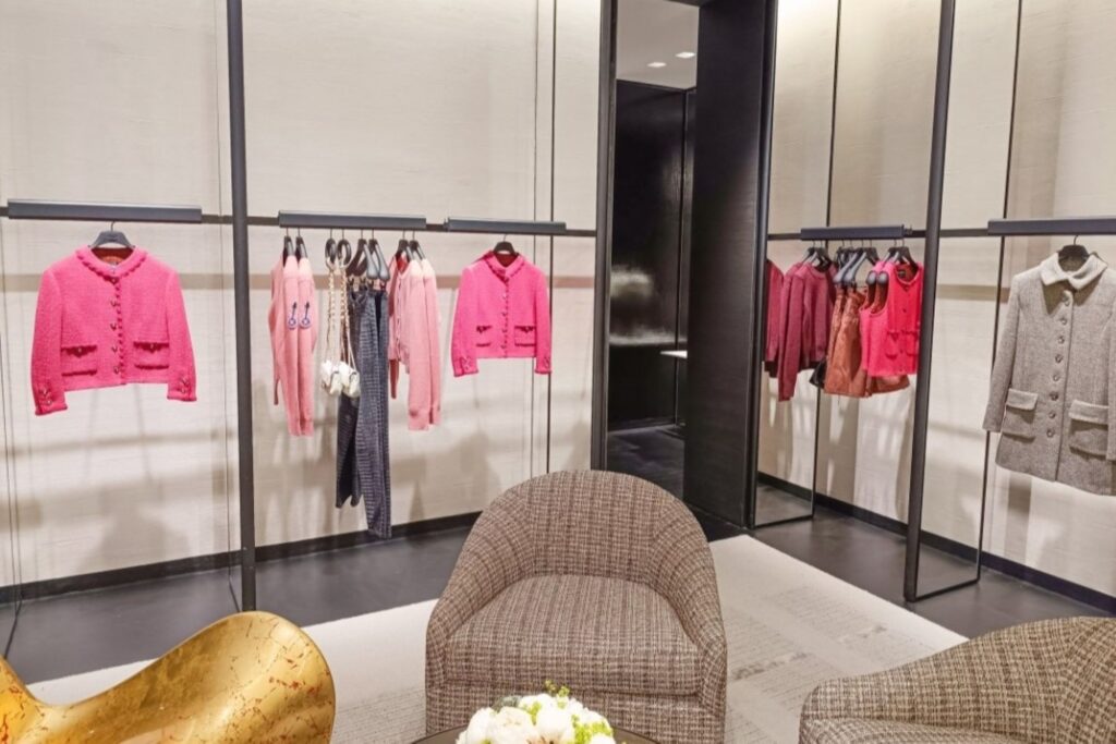 Luxury fashion products displayed in European retail store representing high-end brand performance and sales