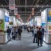 Trade exhibition booths at Anuga showing food industry products and investment opportunities for European market