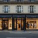 Luxury fashion retail stores on European street showing high-end brand performance and premium shopping economics
