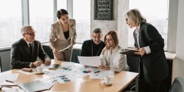 European private equity investment meeting with regional fund professionals analyzing deal flow opportunities