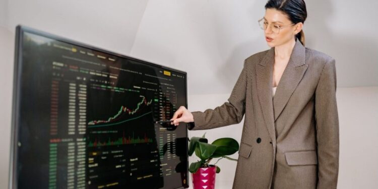 A businesswoman reviews a map of EU cohesion funds allocation by region in a modern office