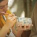 A woman artisan hand-painting porcelain in one of Europe's most celebrated EU-protected craft regions