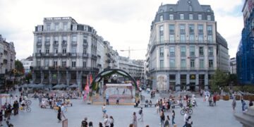 A group of visitors exploring creative installations at the NEB Festival in Brussels's Parc du Cinquantenaire