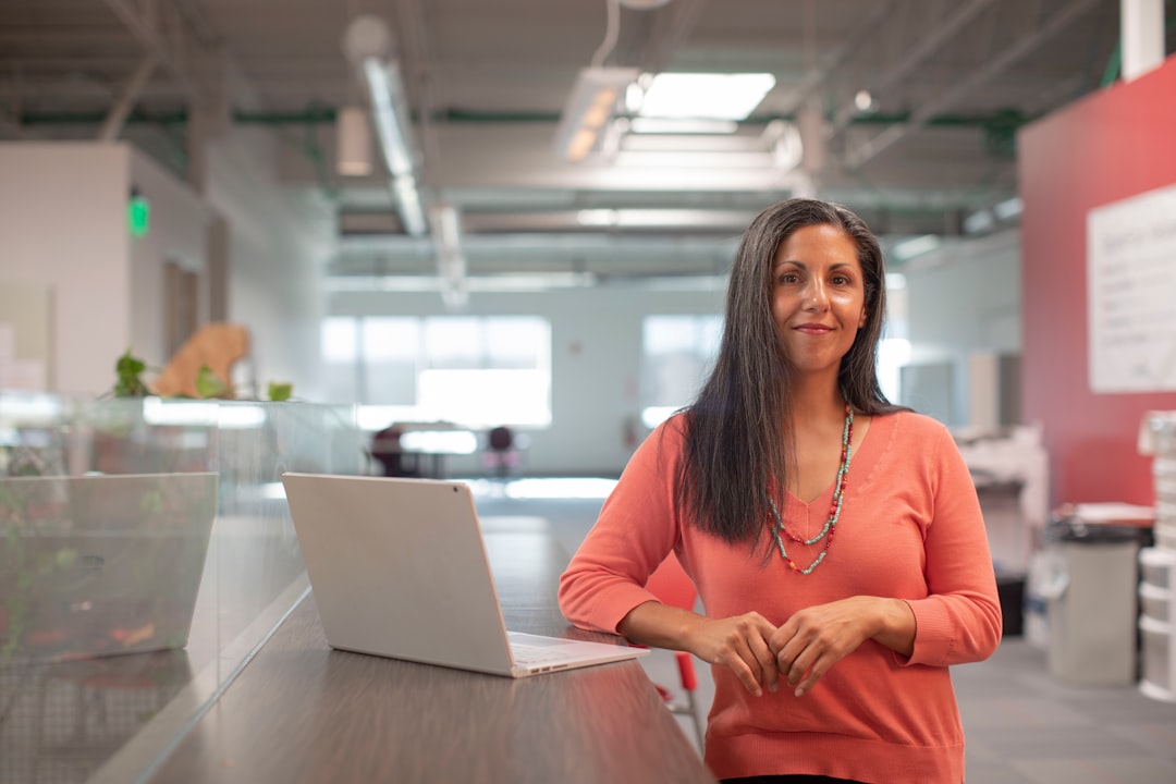 A female entrepreneur in a European office exploring EU budget funding opportunities for green technology innovation