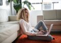 A woman reviewing her EU consumer rights after completing an online purchase on her laptop at home
