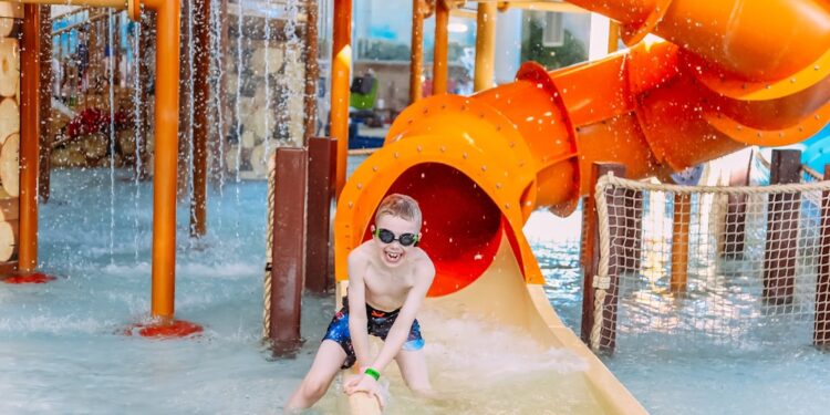 A family enjoying a thrilling water slide at one of Europe's top aqua parks on a sunny summer day