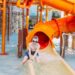 A family enjoying a thrilling water slide at one of Europe's top aqua parks on a sunny summer day