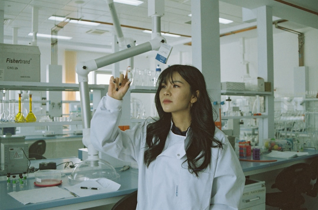 A cosmetic scientist reviews ingredient formulations in a laboratory, illustrating the science behind EU cosmetic standards.
