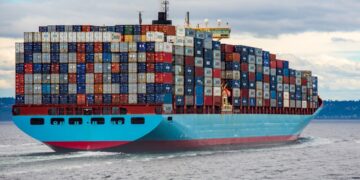 Large cargo container ship at sea transporting goods across European waters, representing EU single market trade and logistic