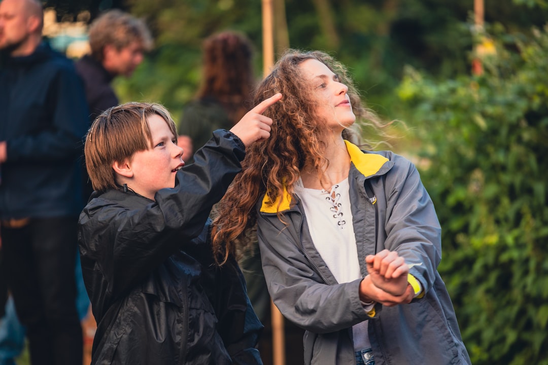 A parent and child discovering an interactive exhibit together at outdoor science festivals across the European Union
