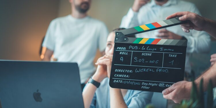 A filmmaker reviews footage on a laptop during a Creative Europe supported film production project