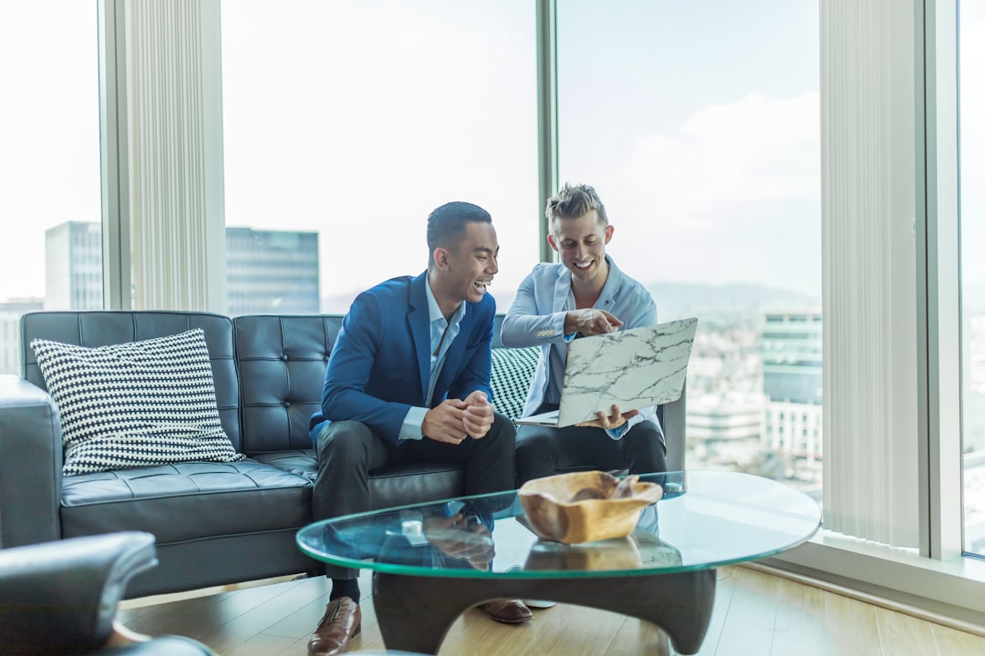 A financial advisor shows a client how to access EU green bonds through a UCITS ETF on a trading platform.