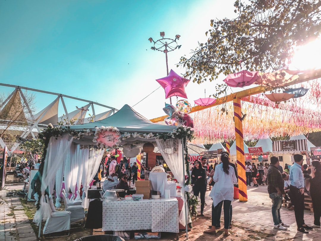 A group of friends enjoying allergen free dishes together at a colourful EU summer festival