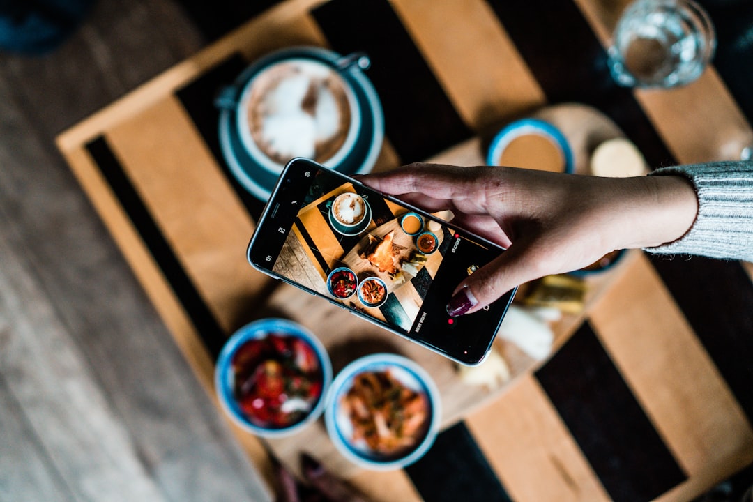 A festival visitor using a digital app to identify allergen free options at an EU summer food event