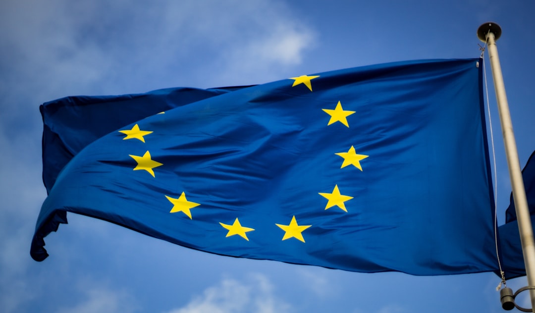 A small business team discusses cross-border e-commerce VAT rules around a shared desk