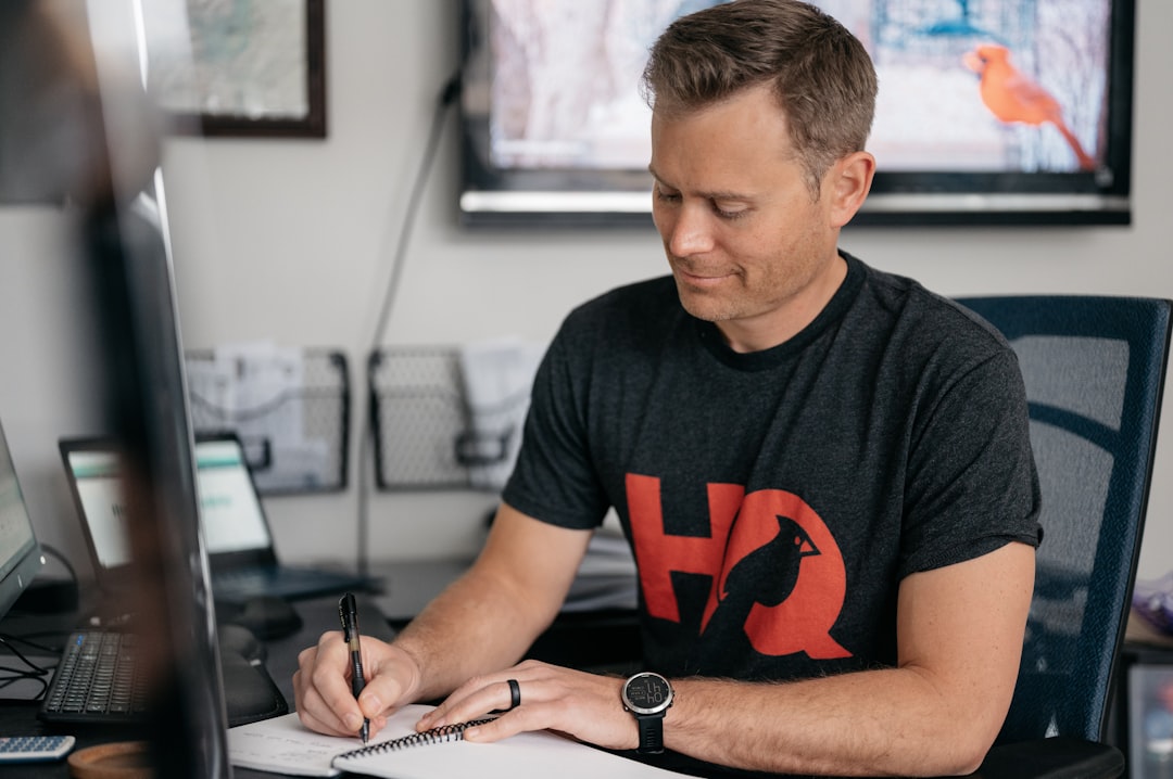 A startup founder signs a digital form as part of an EU subsidiary registration via the BRIS central interface.