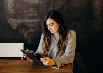 An investor reviews EU green bonds documentation, studying taxonomy alignment reports before making a purchase decision.