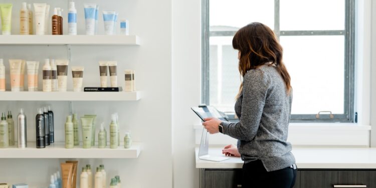 A woman carefully examines a product label in a pharmacy, reflecting the transparency promised by EU cosmetic standards.