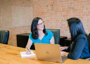A financial adviser explains ELTIF 2.0 investment options to a retail investor during a one-to-one meeting