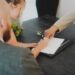 A startup founder signing EU trademark registration documents as part of an IP protection strategy