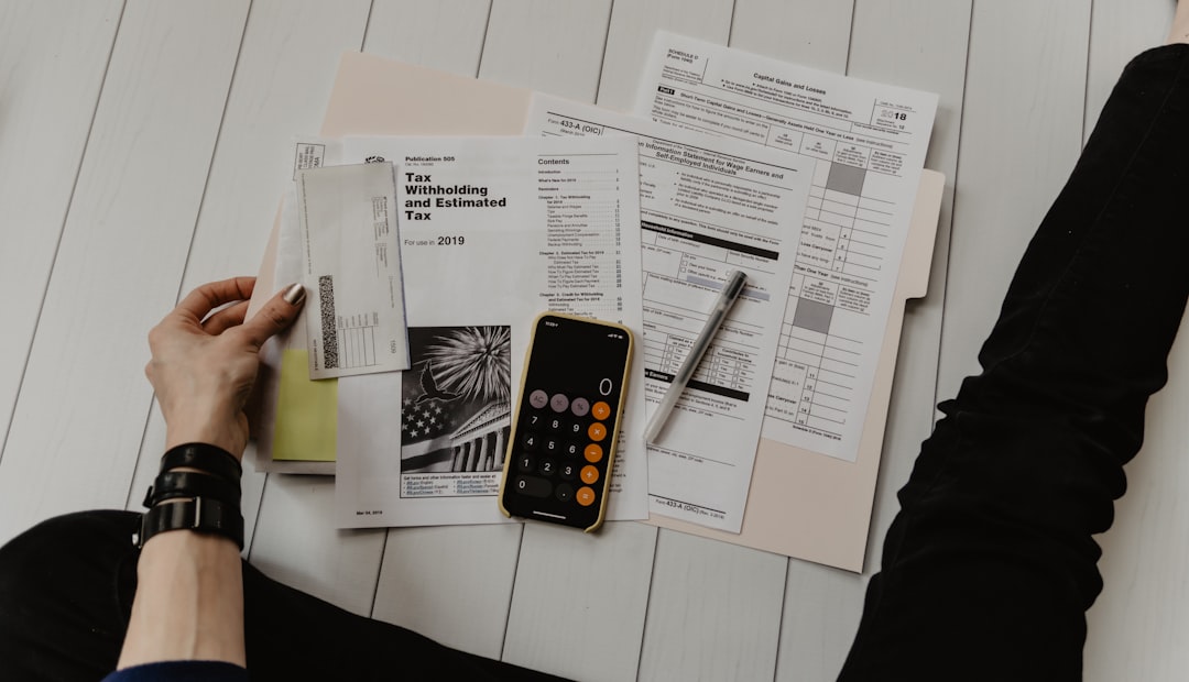 A male investor studies ELTIF 2.0 fund documentation and diversification requirements at a desk