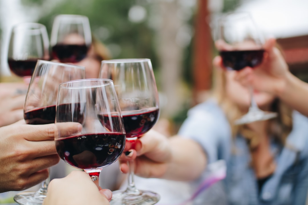 A traveller receives a guided tasting at a cellar door in a quiet EU wine town before the September harvest crowds arrive.