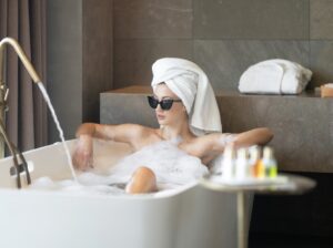 A woman resting peacefully at a certified EU thermal spa, embodying the restorative promise of private wellness retreats.