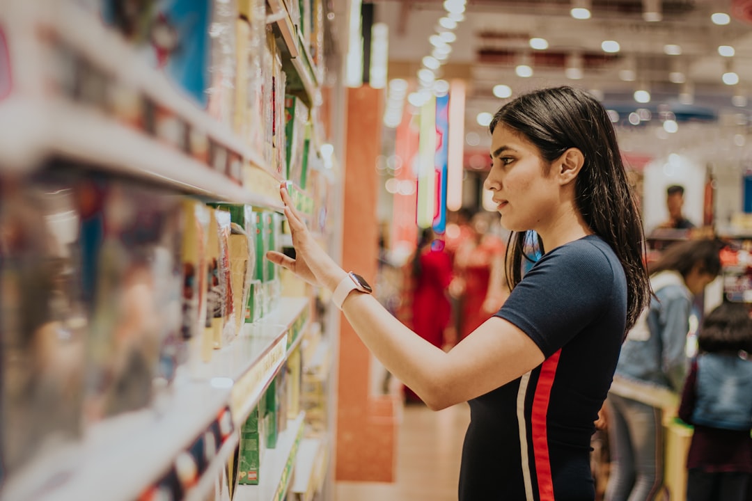 A woman selecting EU Ecolabel certified personal care products from a sustainable retail shelf