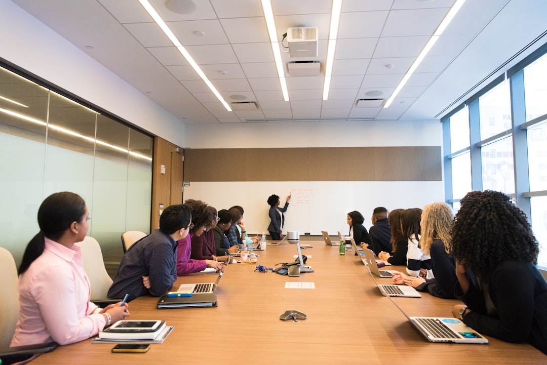 A multicultural business team discusses state aid compliance strategy before scaling into new EU member states