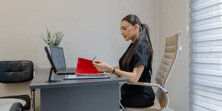 A procurement manager reviews EU supplier contracts at her desk before Q4 negotiations begin