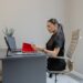 A procurement manager reviews EU supplier contracts at her desk before Q4 negotiations begin