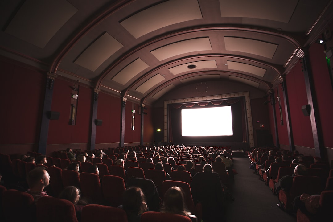Audiences watching a film in a European cinema, experiencing stories made possible by the EU co-production treaty framework.