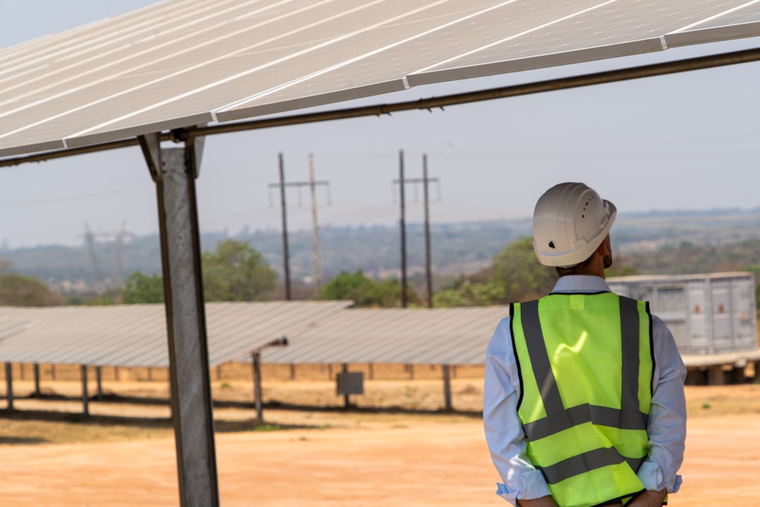 A renewable energy engineer inspects a solar facility representing assets held by infrastructure funds across the EU