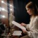 A filmmaker reviews a script at a production desk, representing the creative process behind a co-production treaty.