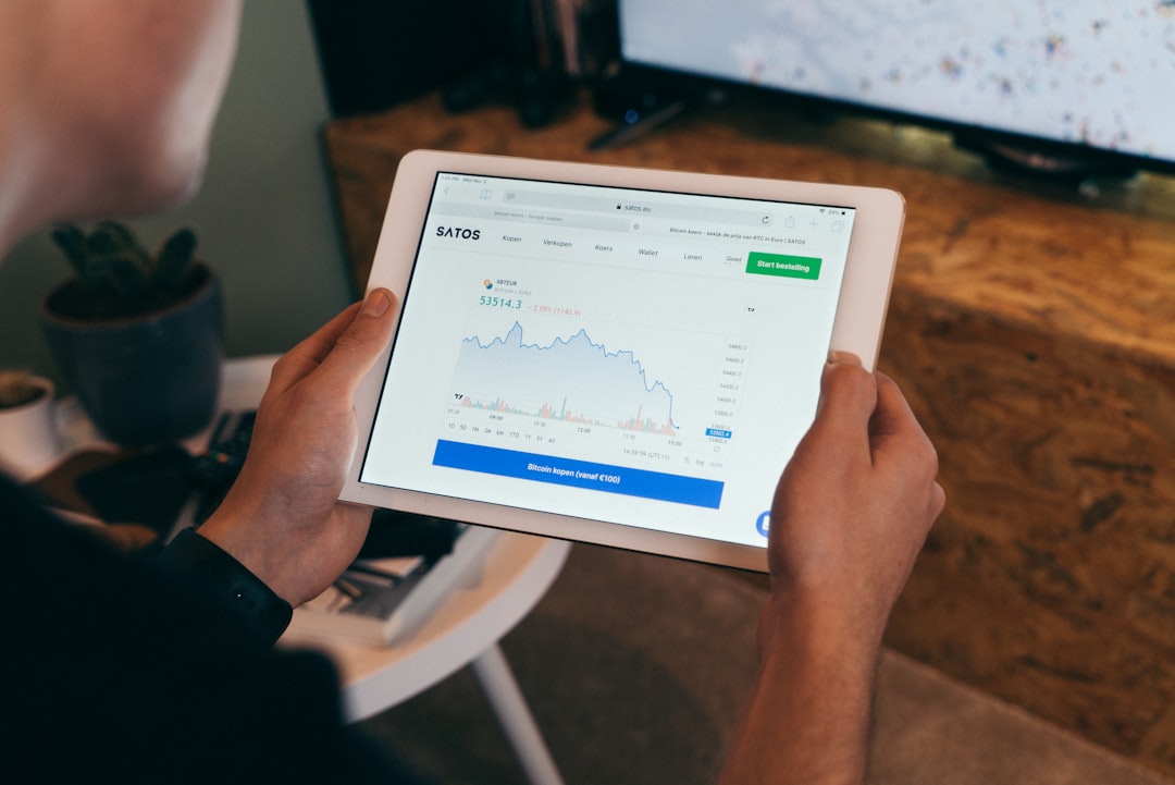 A retail investor analyzes infrastructure funds performance data on a digital screen before making a long-term decision