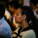 woman-watching-parliament-speech-unsplash - EUwebzine A woman follows the State of Union address on a screen, engaged with the future of European democracy and citizens' rights.