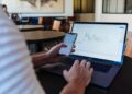 Investor checking STOXX 600 results during earnings season
