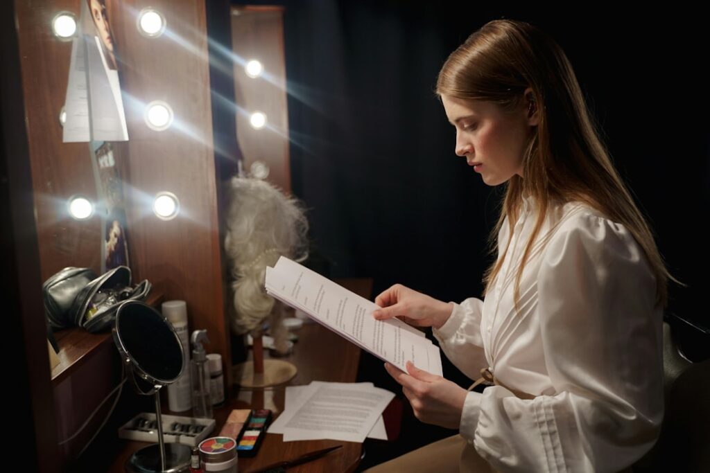A filmmaker reviews a script at a production desk, representing the creative process behind a co-production treaty.