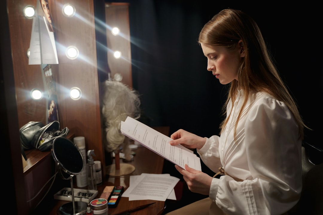 A filmmaker reviews a script at a production desk, representing the creative process behind a co-production treaty.