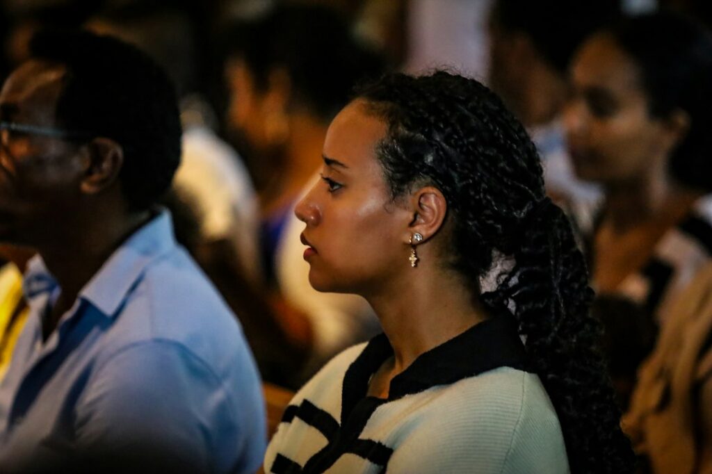 A woman follows the State of Union address on a screen, engaged with the future of European democracy and citizens' rights.
