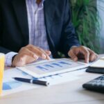 Investor reviewing earnings season results on a laptop